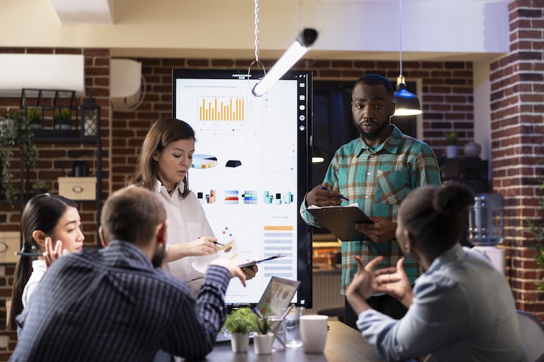 Employees preparing for business presentation